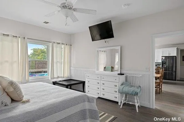 a bathroom with a double vanity sink toilet mirror and shower