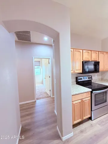 a kitchen with stainless steel appliances a stove and a refrigerator