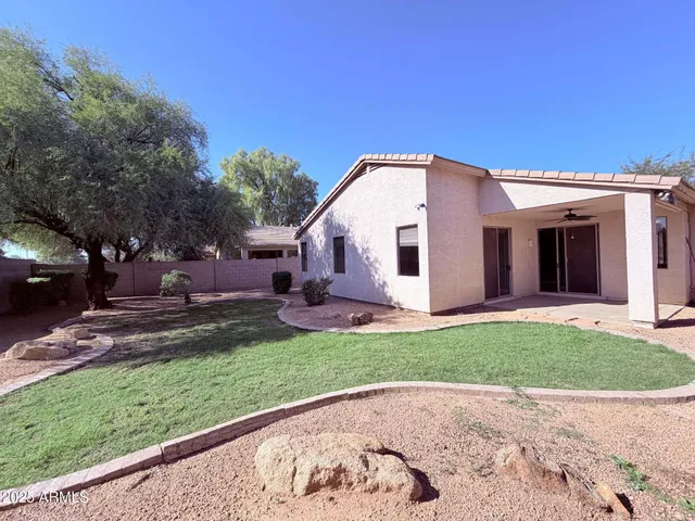 a view of a back yard of the house