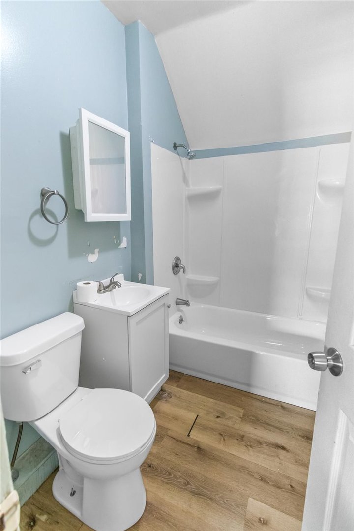 257 West 109th Place, Unit 2 Chicago, IL 60628 - Photo 11 of 11 a bathroom with a toilet sink and shower