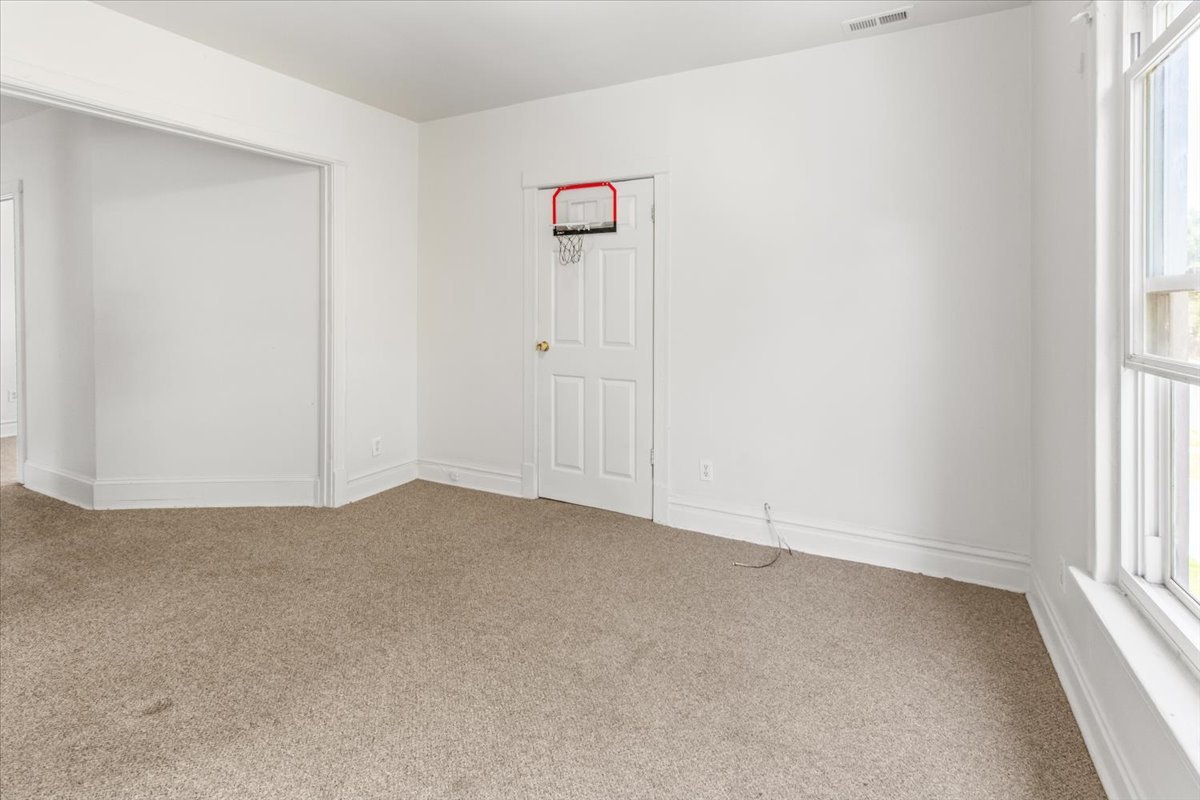 257 West 109th Place, Unit 2 Chicago, IL 60628 - Photo 3 of 11 an empty room with windows