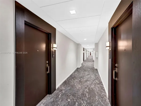 a view of a hallway to other door