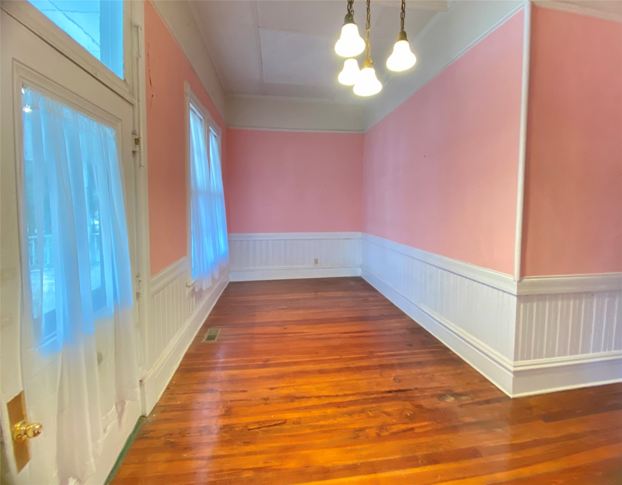 223 East Robert Toombs Avenue Washington, GA 30673 - Photo 10 of 46 a view of a room with wooden floor and fan