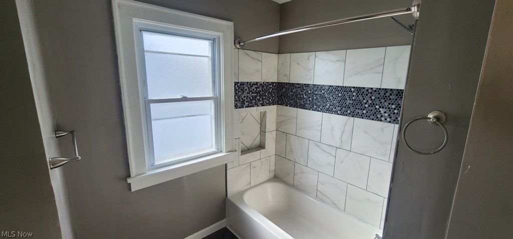 1514 Clermont Road Cleveland, OH 44110 - Photo 7 of 16 Bathroom featuring shower / tub combination and baseboards