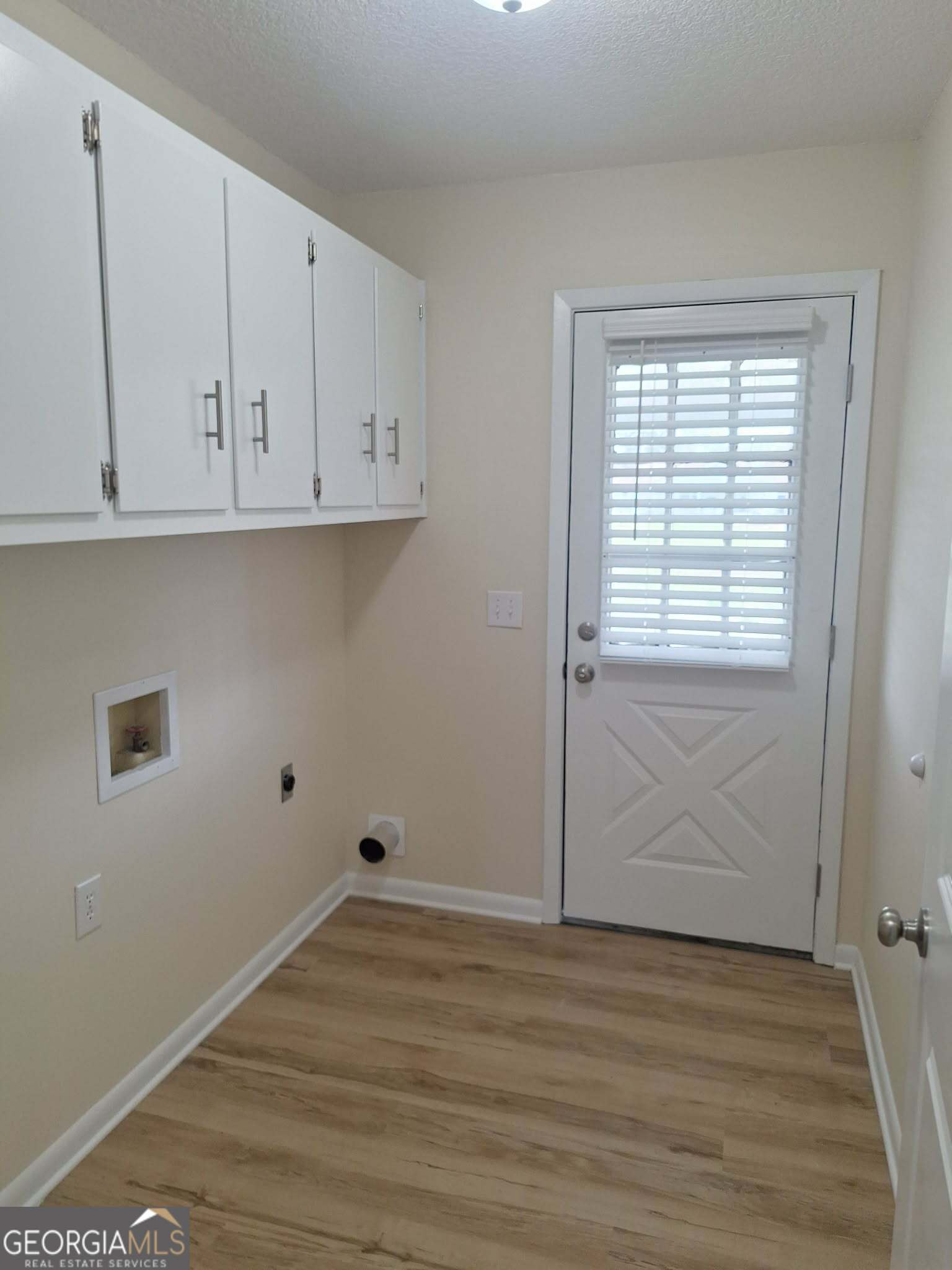 249 Satilla Church Road Baxley, GA 31513 - Photo 20 of 26 a view of an empty room with wooden floor