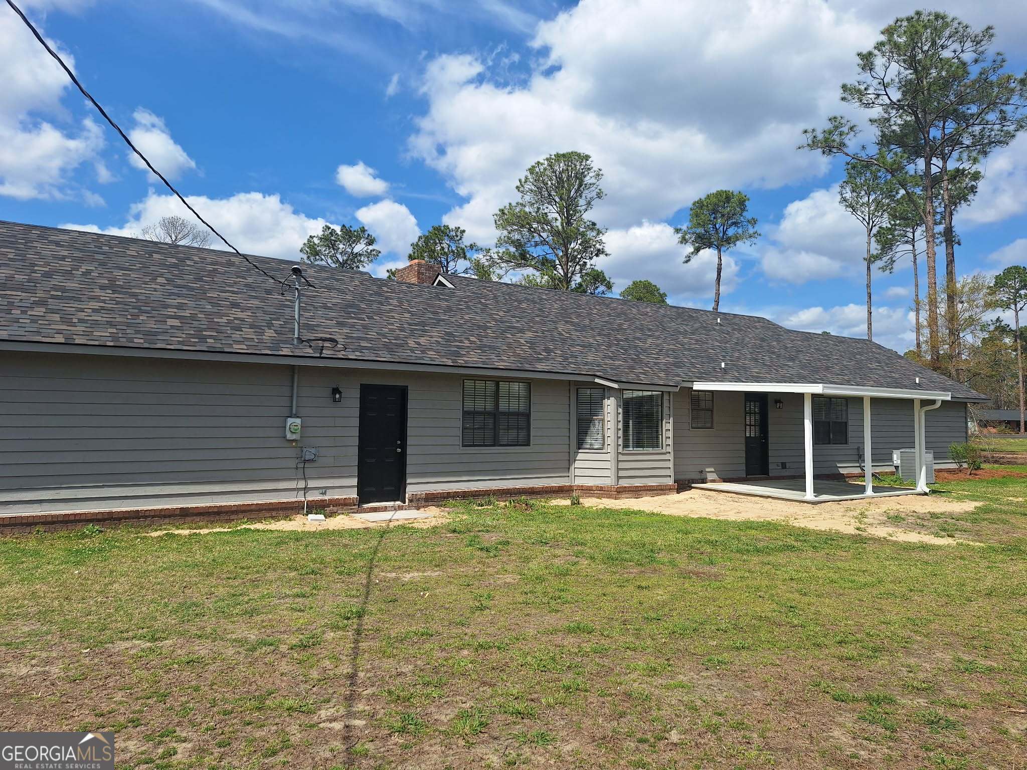 249 Satilla Church Road Baxley, GA 31513 - Photo 24 of 26 a house view with a garden space