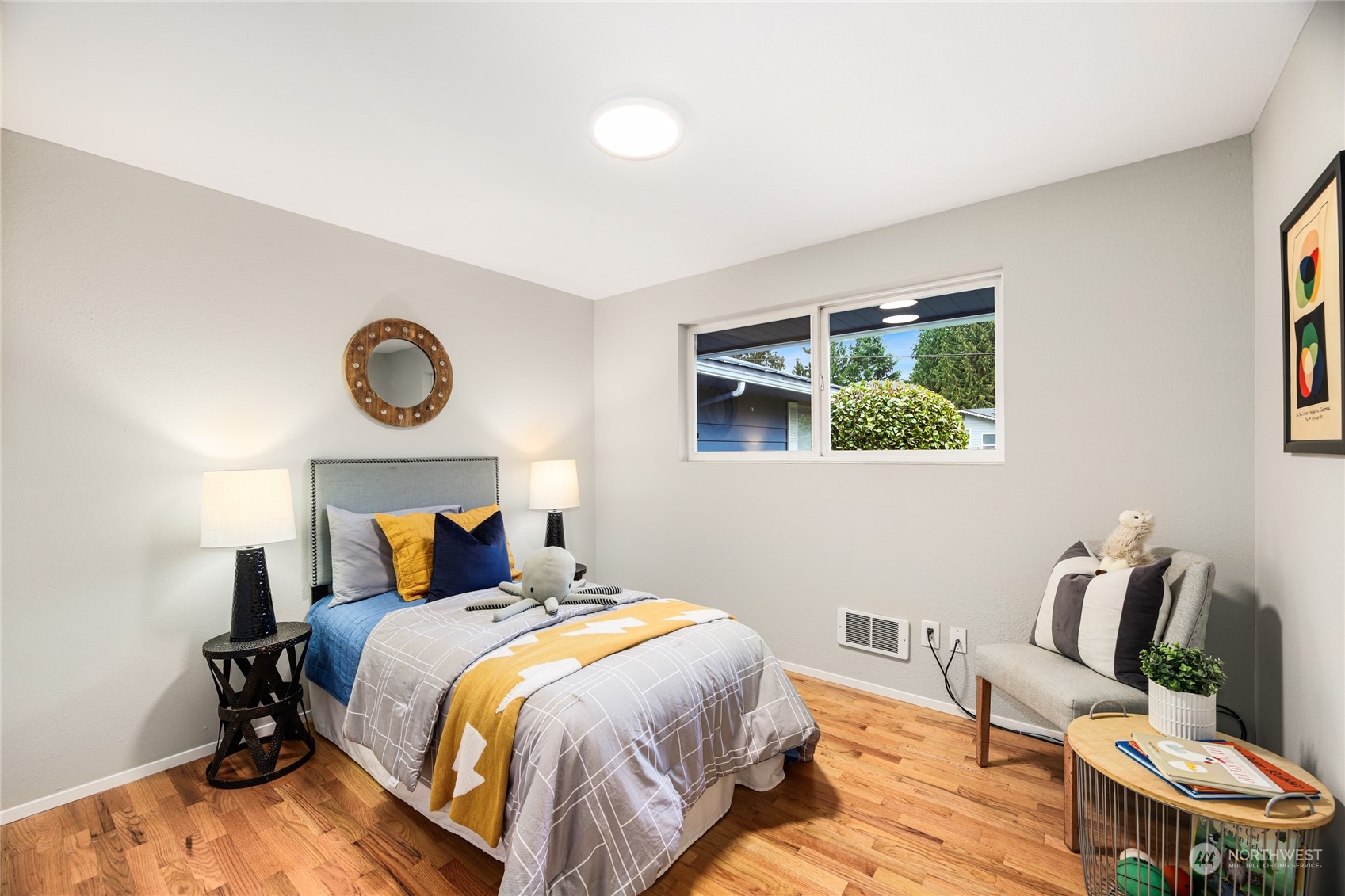 10810 9th Drive Southeast Everett, WA 98208 - Photo 13 of 26 a bedroom with a bed and wooden floor