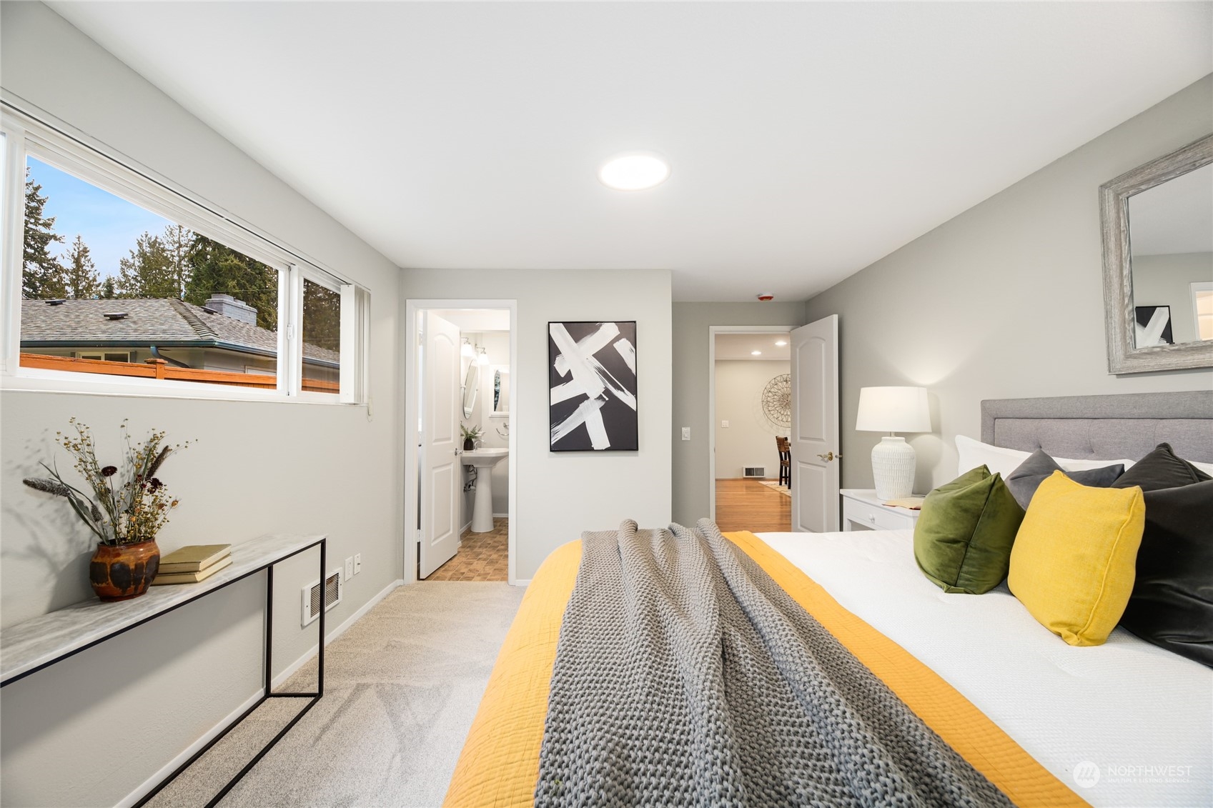 10810 9th Drive Southeast Everett, WA 98208 - Photo 16 of 26 a bedroom with a large bed and a chandelier