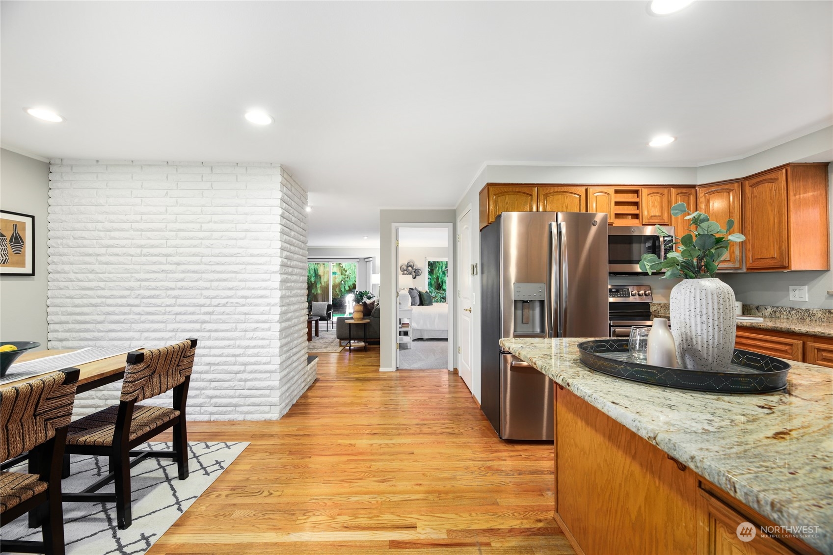 10810 9th Drive Southeast Everett, WA 98208 - Photo 8 of 26 a dining hall with stainless steel appliances granite countertop a granite counter tops chairs a sink and a refrigerator