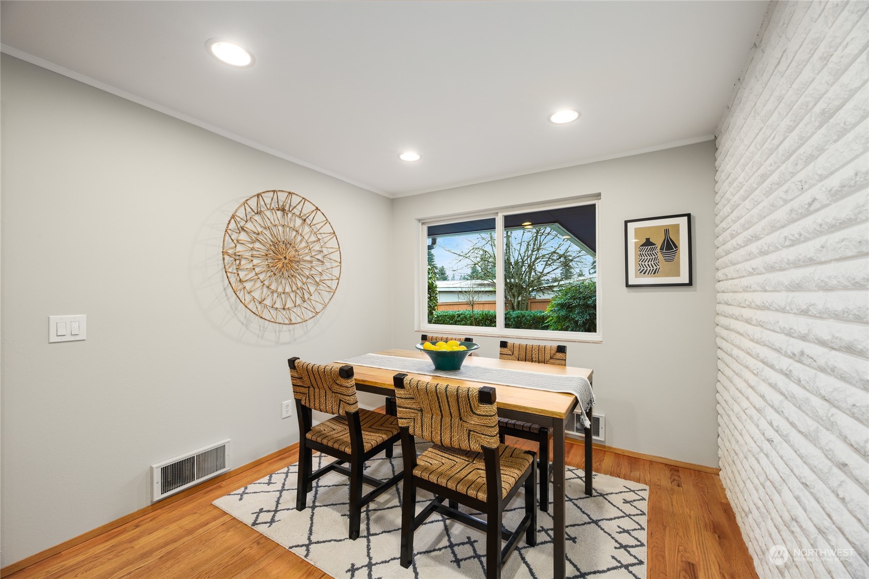 10810 9th Drive Southeast Everett, WA 98208 - Photo 9 of 26 a view of a dining room with furniture window and wooden floor