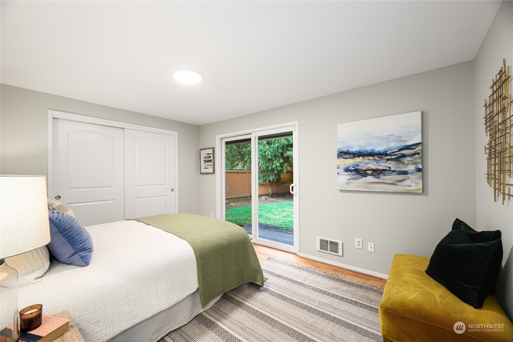 10810 9th Drive Southeast Everett, WA 98208 - Photo 10 of 26 a bedroom with a bed and wooden floor