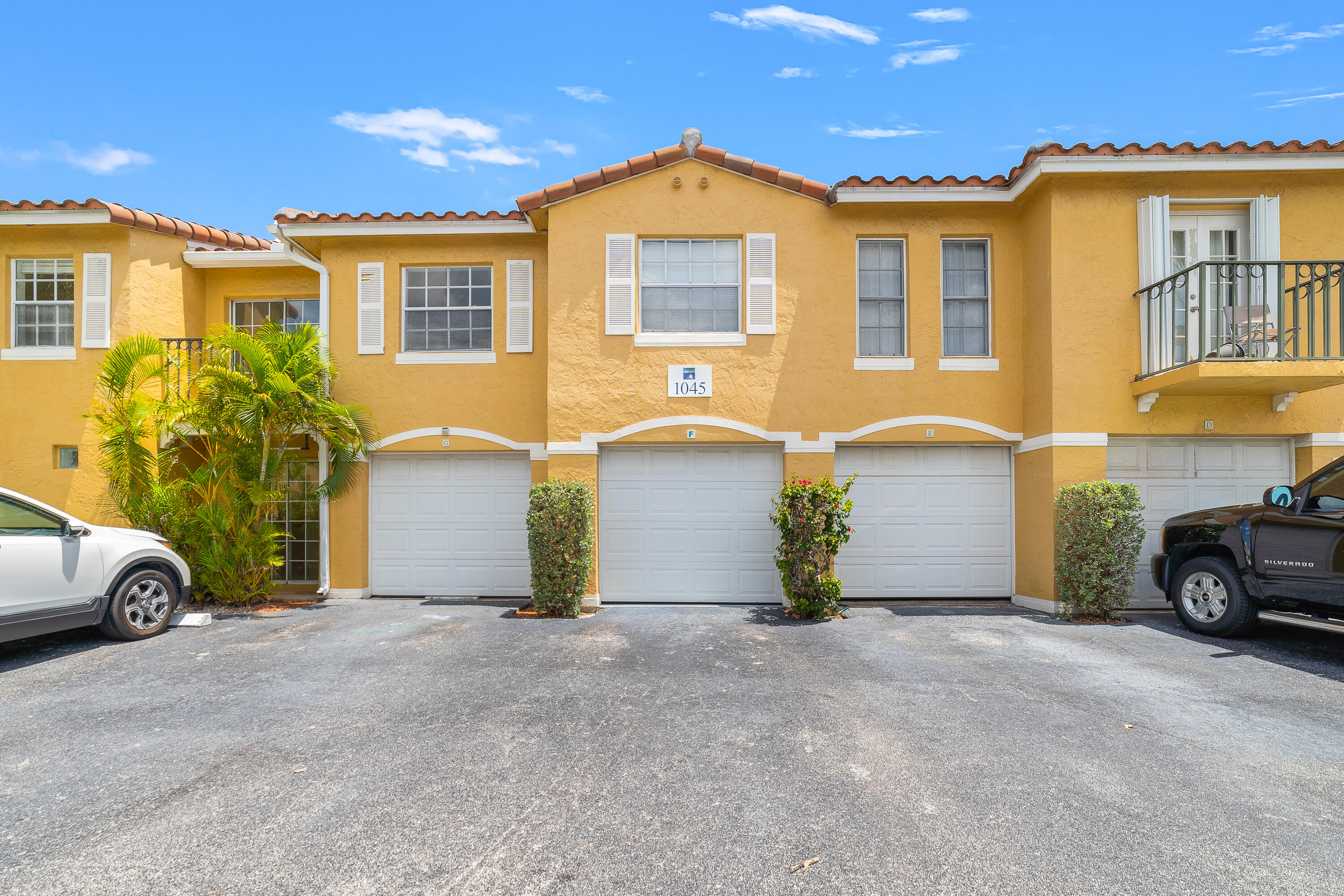 1045 Lake Shore Drive, Unit 105 Lake Park, FL 33403 - Photo 1 of 1 a view of a car park in front of house