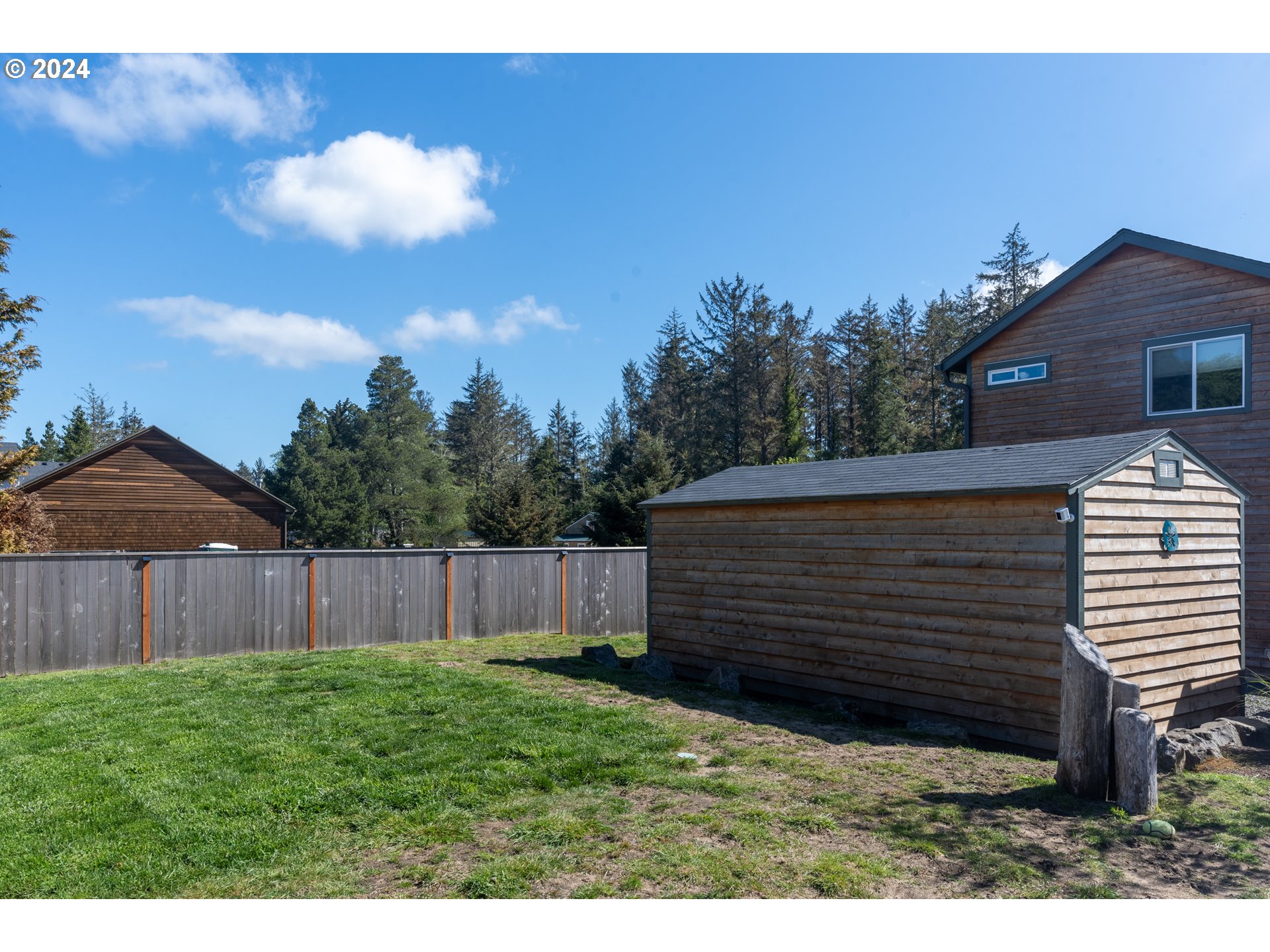 1324 Sea Ridge Lane Gearhart, OR 97138 - Photo 5 of 21 a view of a backyard with a garden