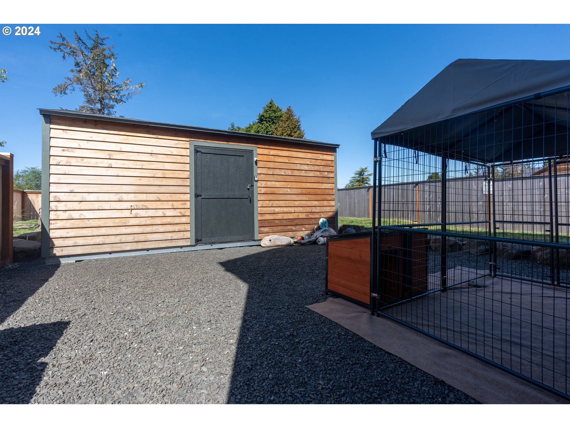1324 Sea Ridge Lane Gearhart, OR 97138 - Photo 7 of 21 a backyard of a house with table and chairs