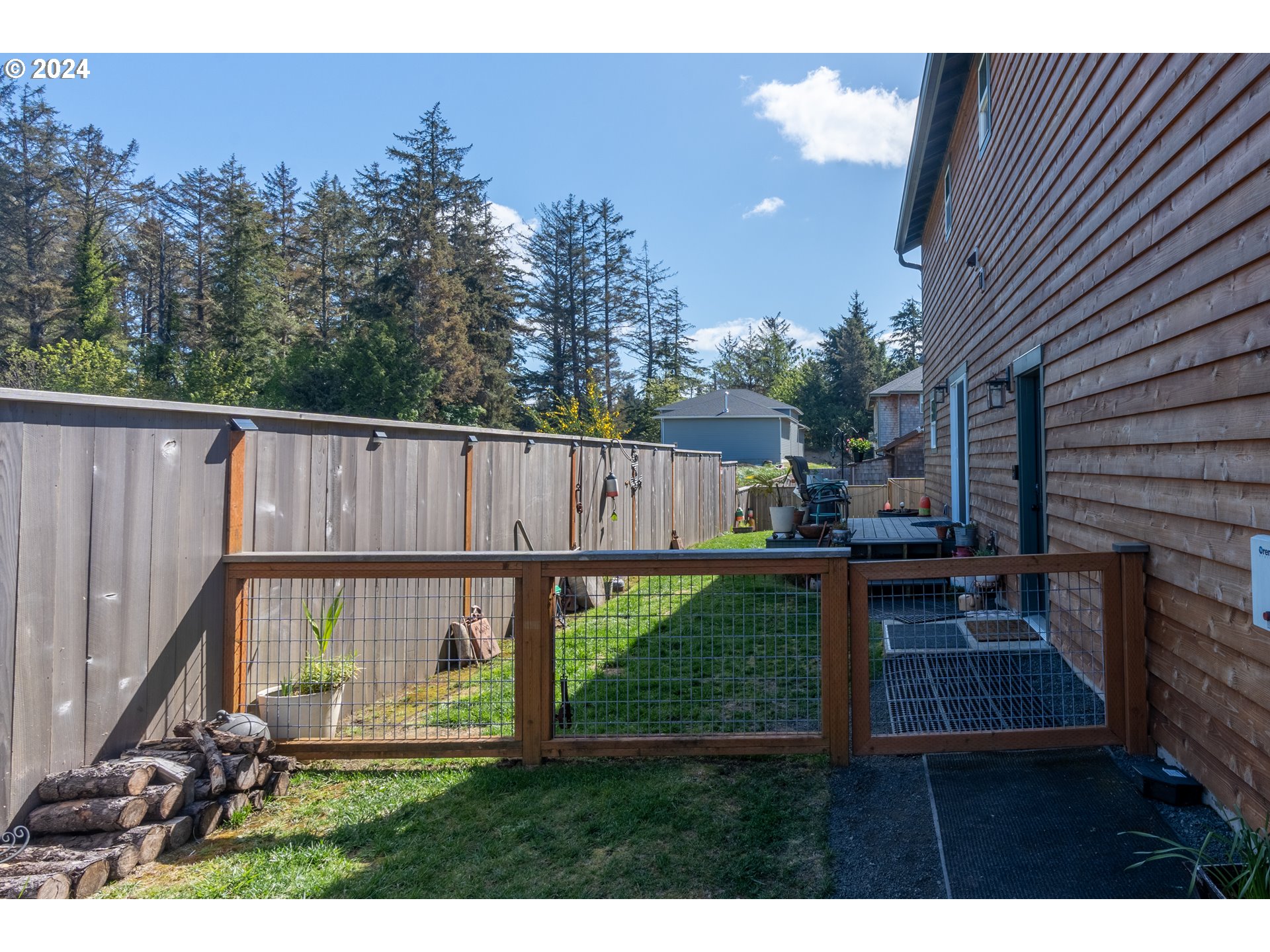 1324 Sea Ridge Lane Gearhart, OR 97138 - Photo 8 of 21 a view of backyard with deck and seating area