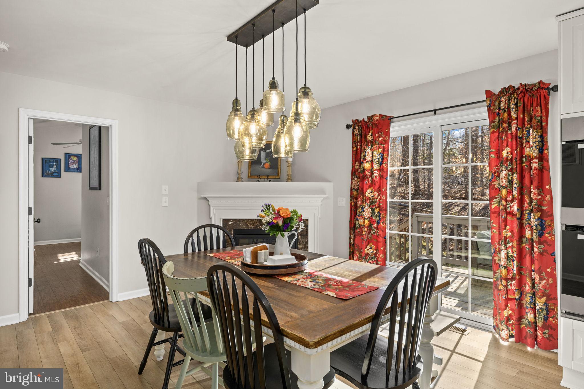 6463 Wheeler Drive King George, VA 22485 - Photo 17 of 57 a view of a dining room with furniture and chandelier