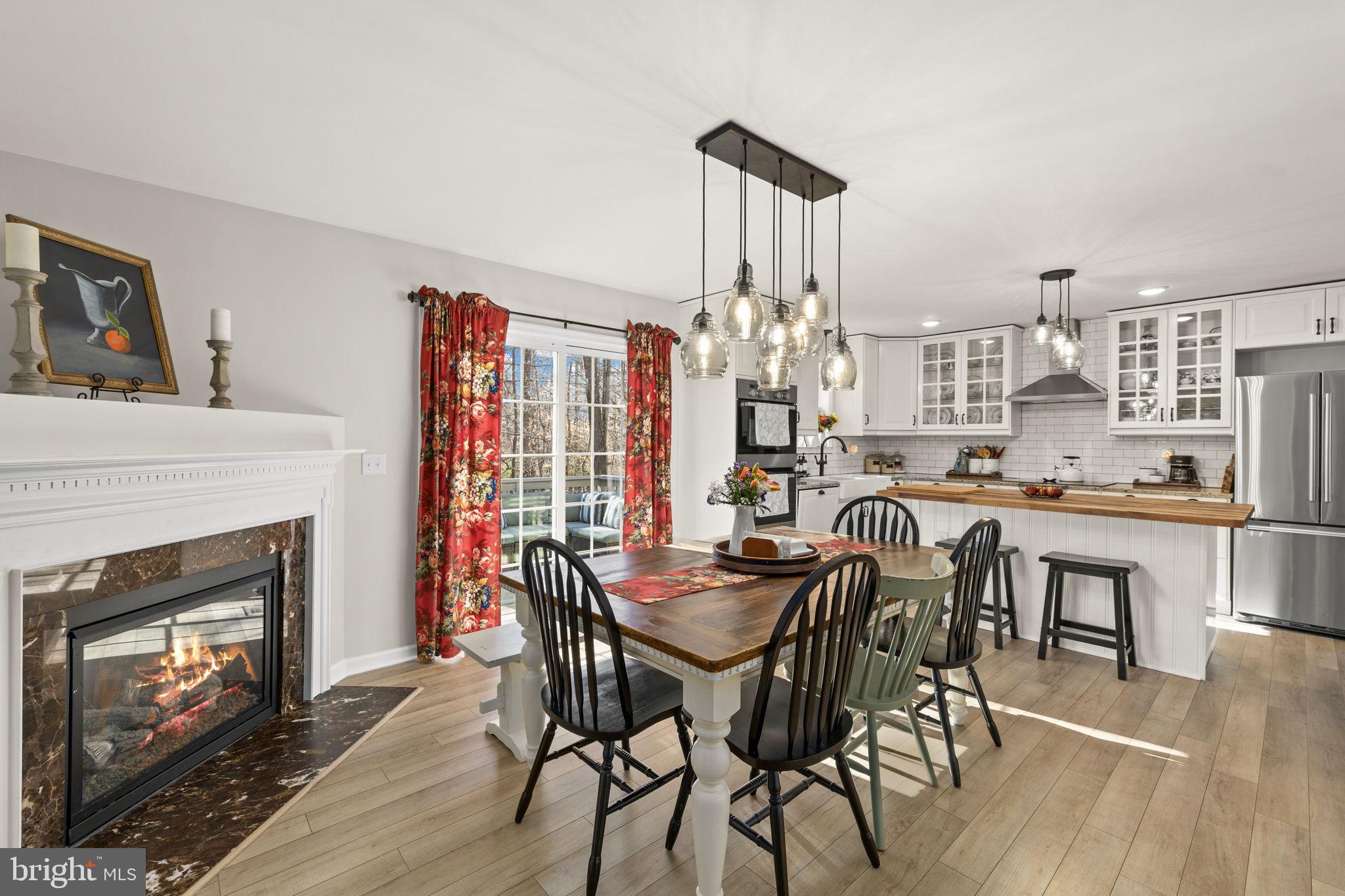 6463 Wheeler Drive King George, VA 22485 - Photo 18 of 57 a view of a dining room with furniture and chandelier