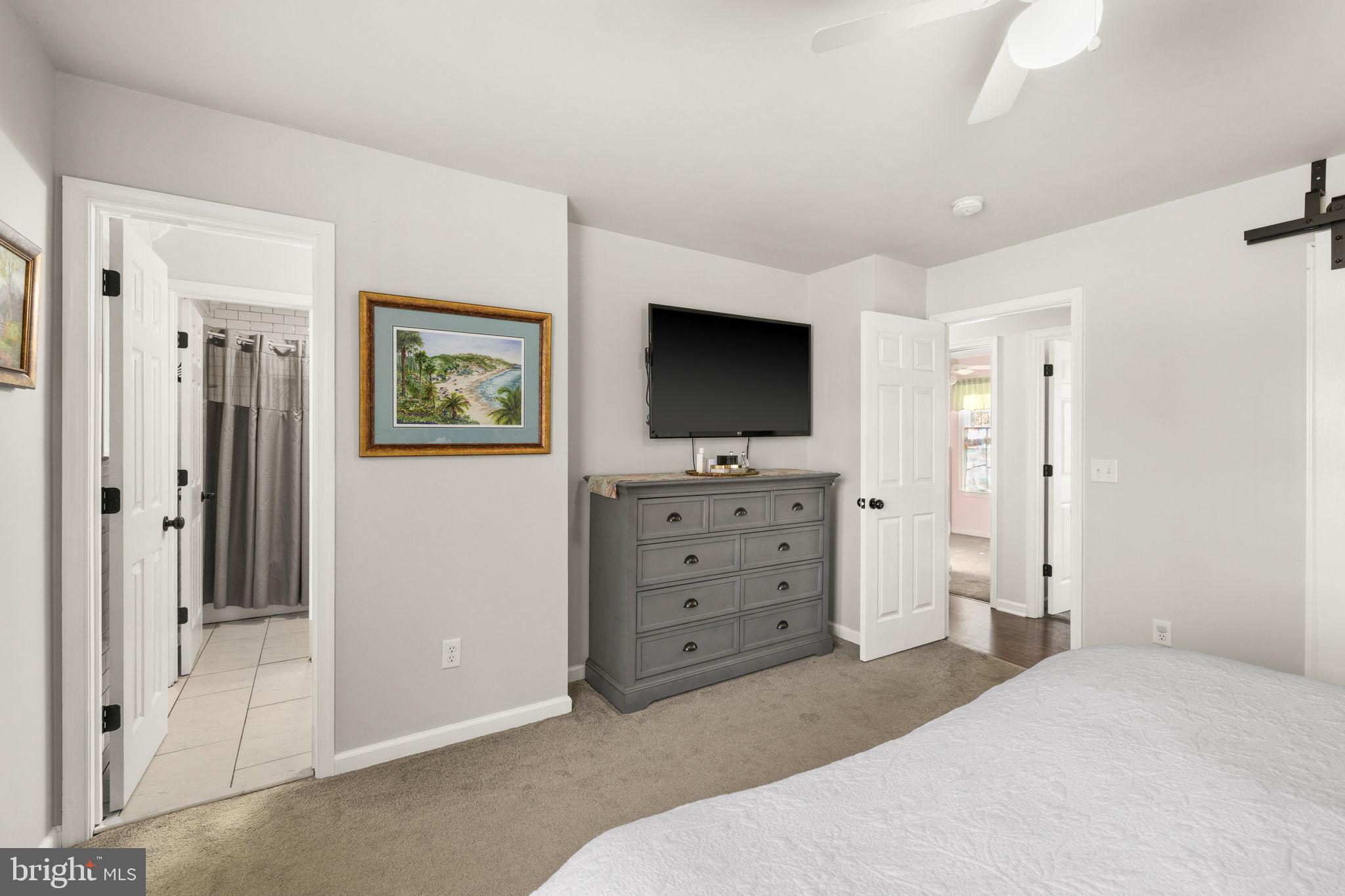 6463 Wheeler Drive King George, VA 22485 - Photo 24 of 57 a bedroom with a bed and a flat screen tv