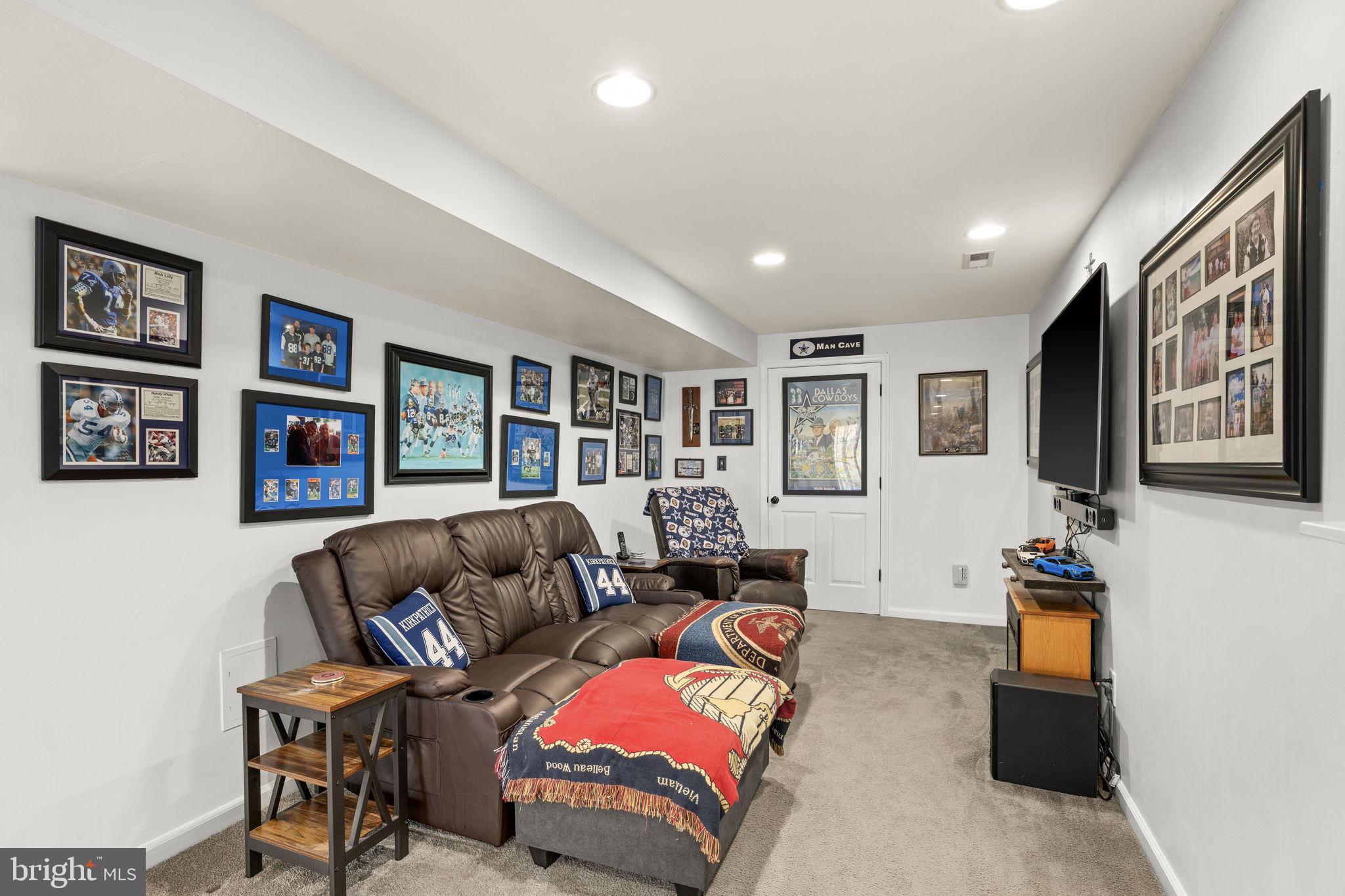 6463 Wheeler Drive King George, VA 22485 - Photo 35 of 57 a living room with furniture and a flat screen tv
