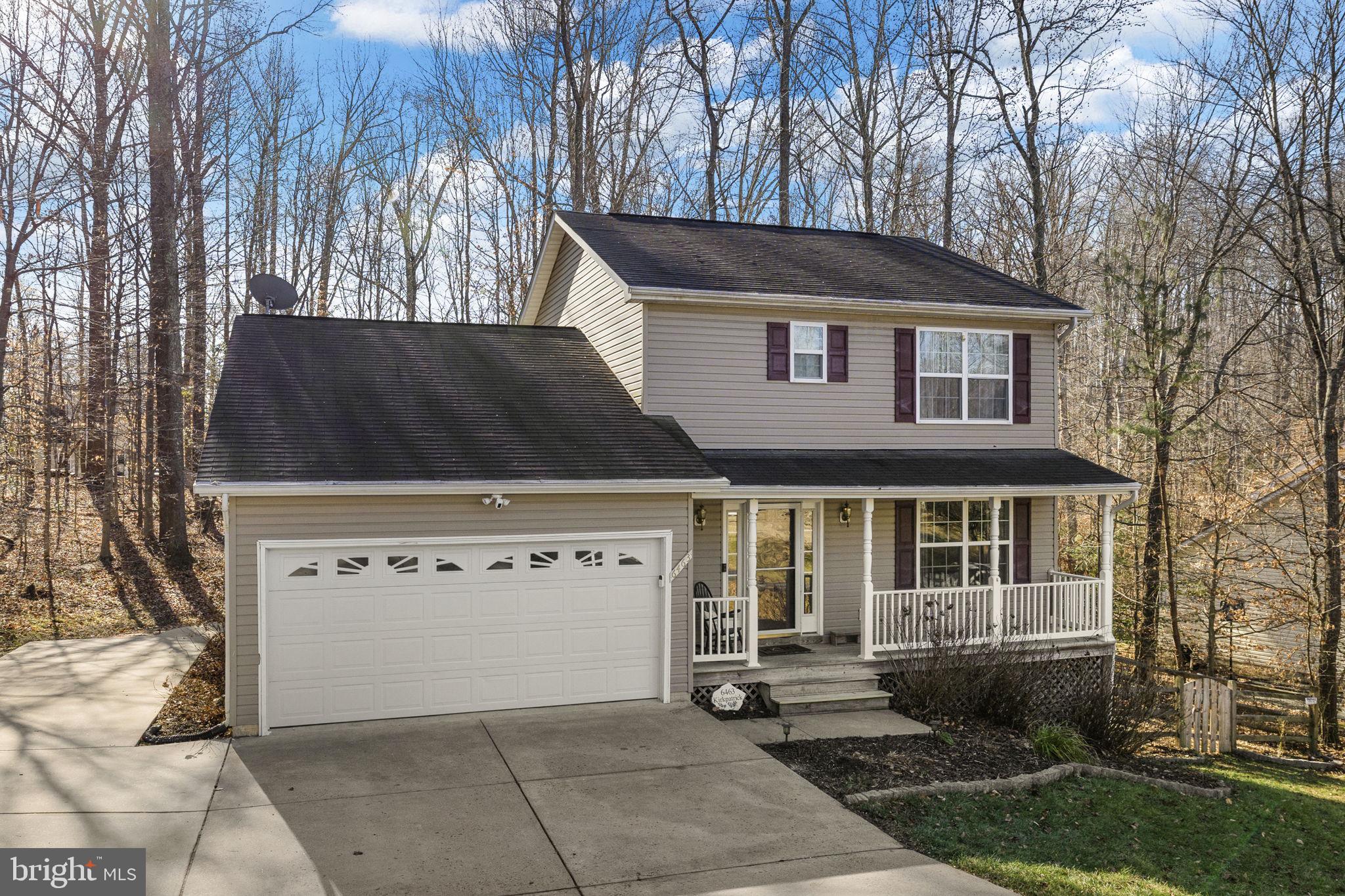 6463 Wheeler Drive King George, VA 22485 - Photo 4 of 57 a front view of a house with a yard
