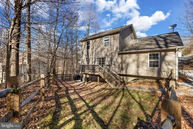 a view of a swimming pool with an outdoor space and seating area