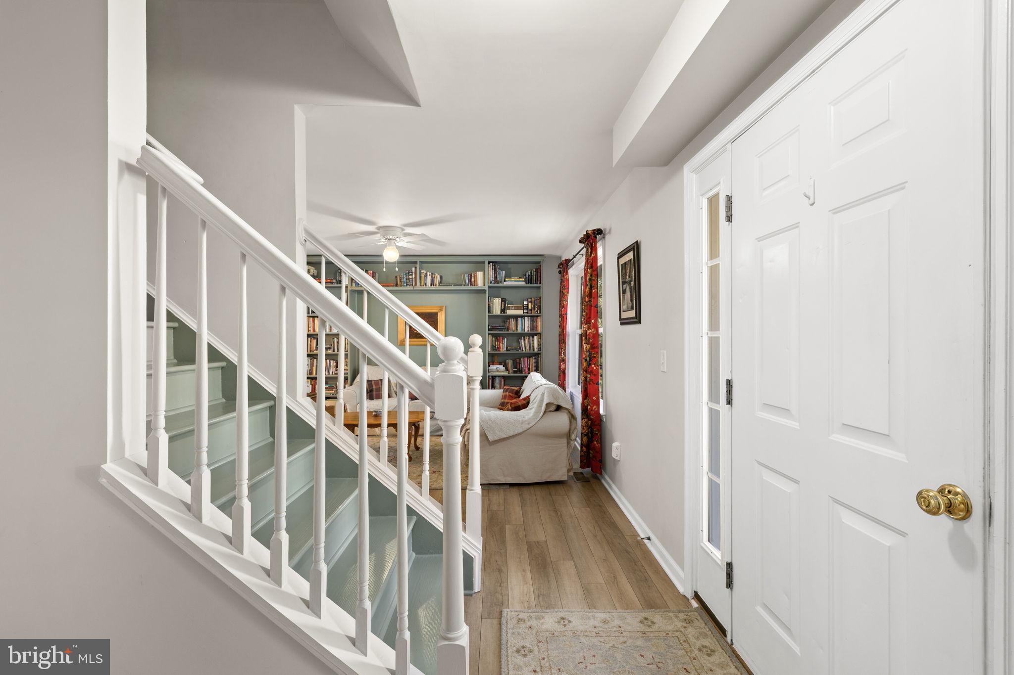 6463 Wheeler Drive King George, VA 22485 - Photo 7 of 57 a view of staircase with lots of frames on wall and a window