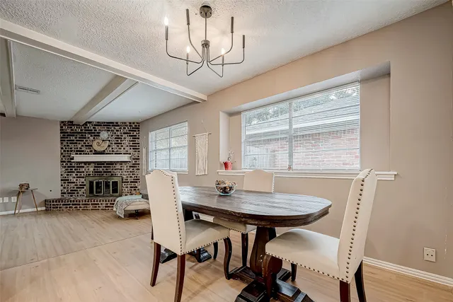 a view of a dining room with furniture and window