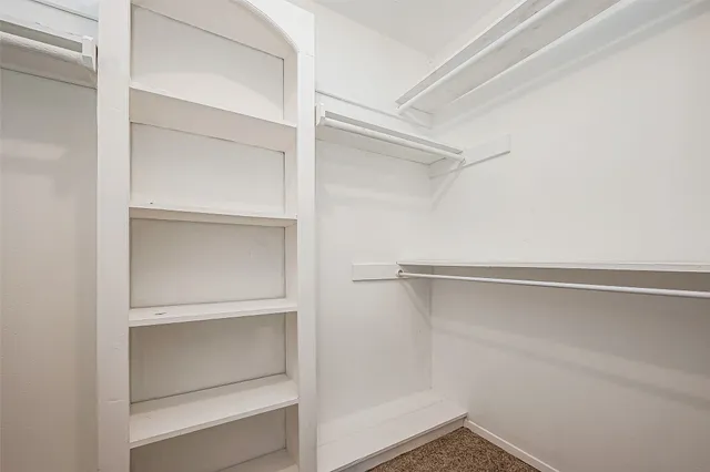 a view of an empty walk in closet