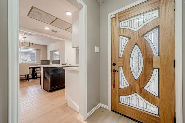 a view of a hallway with washer and dryer