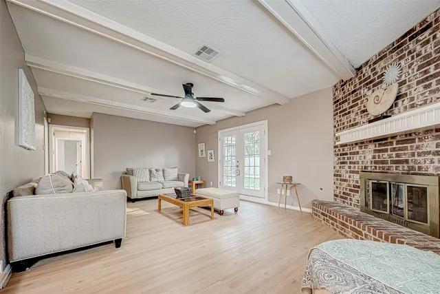 a living room with furniture and a fireplace