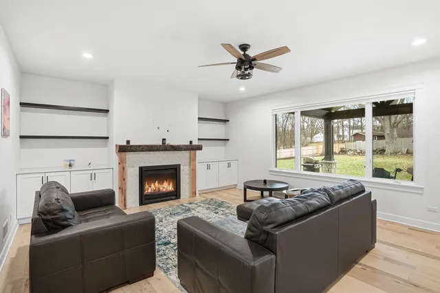 a living room with furniture window and a fireplace