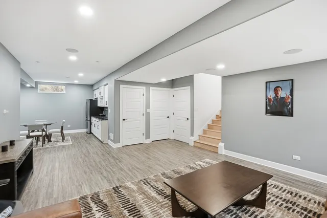 a view of workspace with furniture and wooden floor