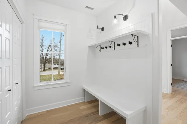 a room with window and white walls