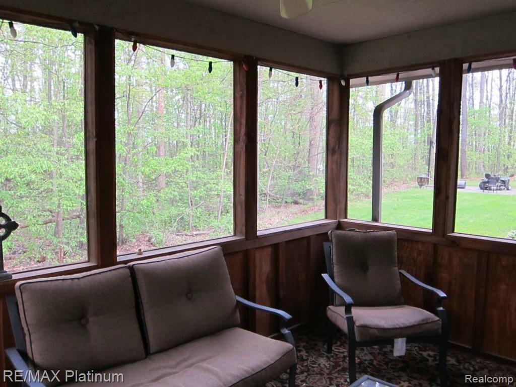 6480 Mack Road Howell, MI 48855 - Photo 13 of 27 Screened Porch 2nd view, showing yard.