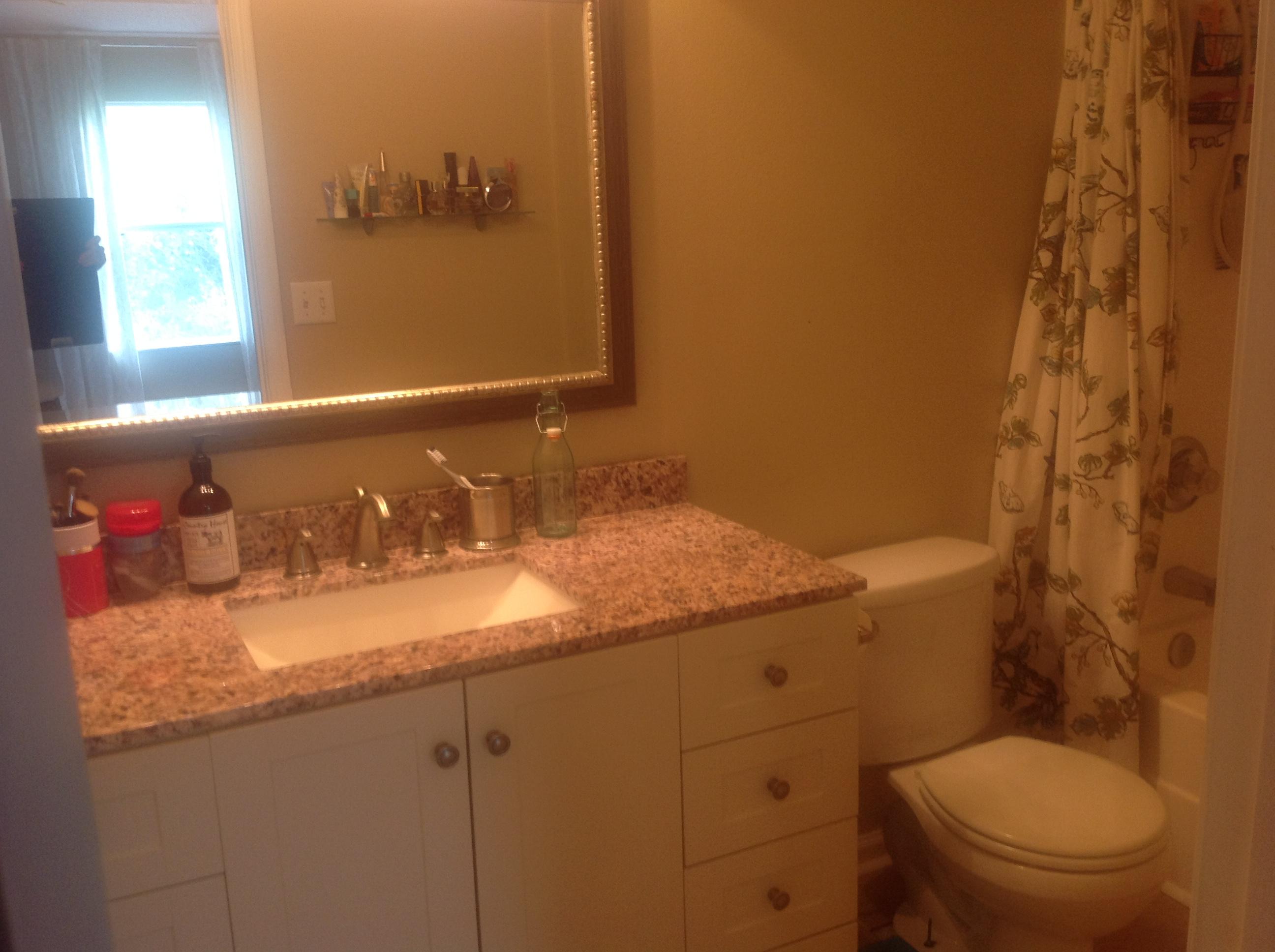 504 Keystone Road Mary Esther, FL 32569 - Photo 13 of 17 a bathroom with a granite countertop sink a toilet and a mirror