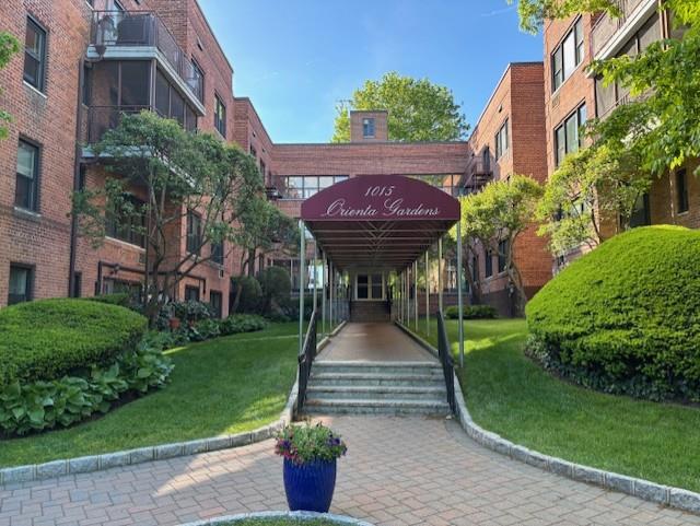 a view of a park with plants and a bench