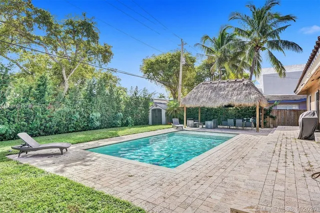 a view of a backyard with a patio
