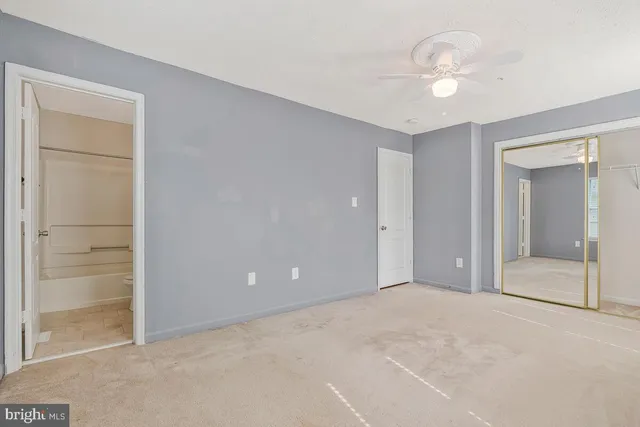 an empty room with closet area