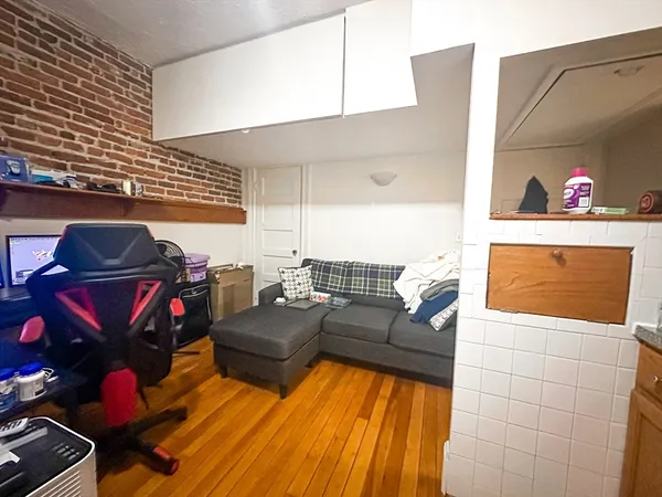 a living room with furniture and a rug