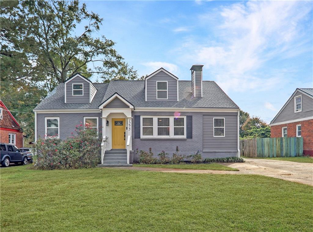 1275 Eastland Road Southeast Atlanta, GA 30316 - Photo 1 of 31 a front view of a house with a garden