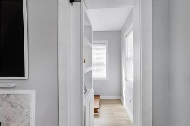a bathroom with a toilet sink and a mirror