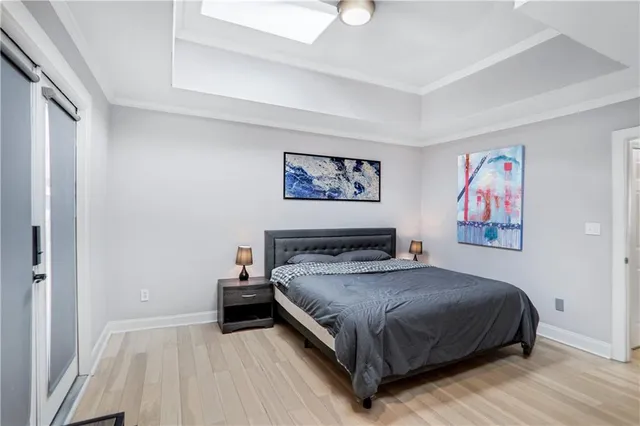 a bedroom with a bed and wall painting