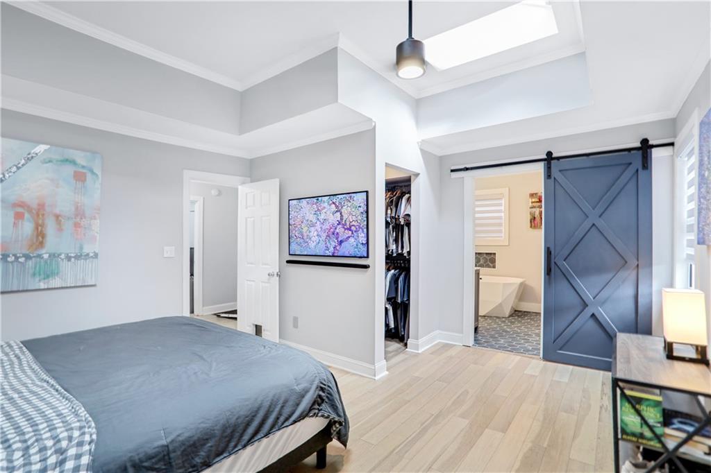 1275 Eastland Road Southeast Atlanta, GA 30316 - Photo 14 of 31 a bedroom with a bed and a window