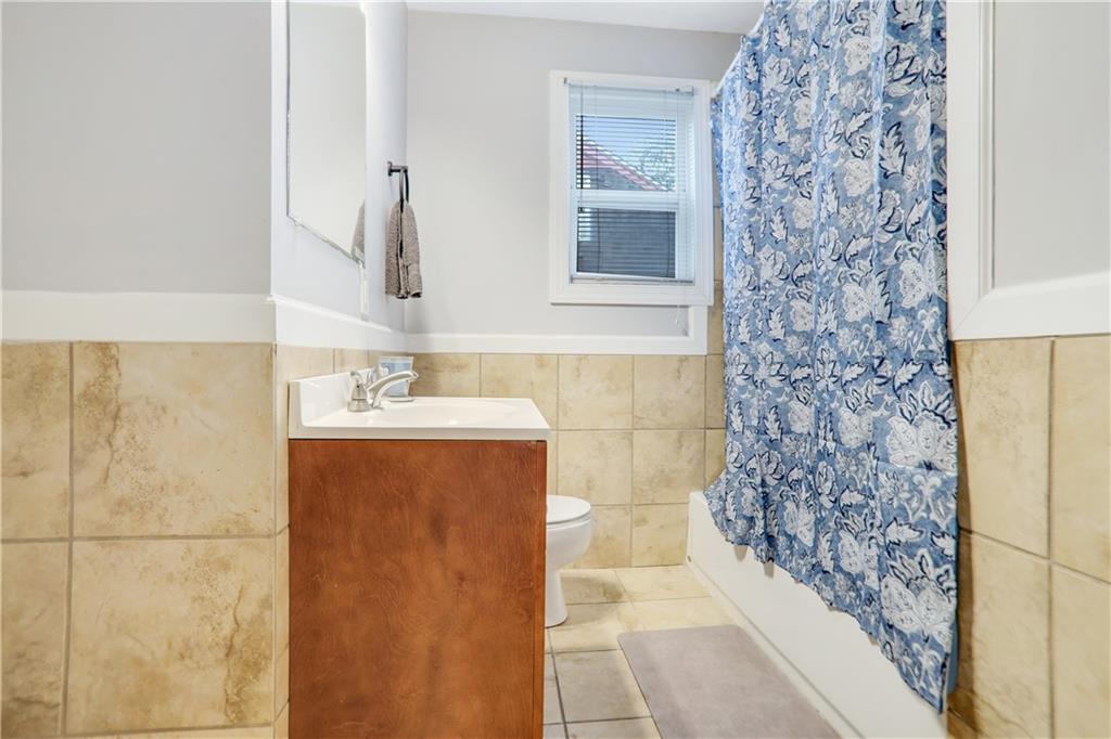 1275 Eastland Road Southeast Atlanta, GA 30316 - Photo 19 of 31 a bathroom with a sink and a mirror