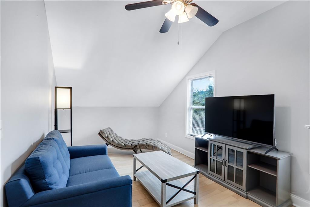 1275 Eastland Road Southeast Atlanta, GA 30316 - Photo 20 of 31 a living room with furniture and a flat screen tv