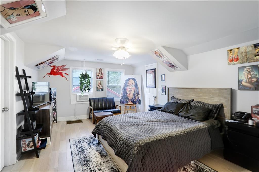 1275 Eastland Road Southeast Atlanta, GA 30316 - Photo 25 of 31 a bedroom with a bed and a tv