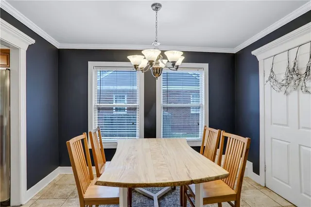 a view of a dining room with furniture and window