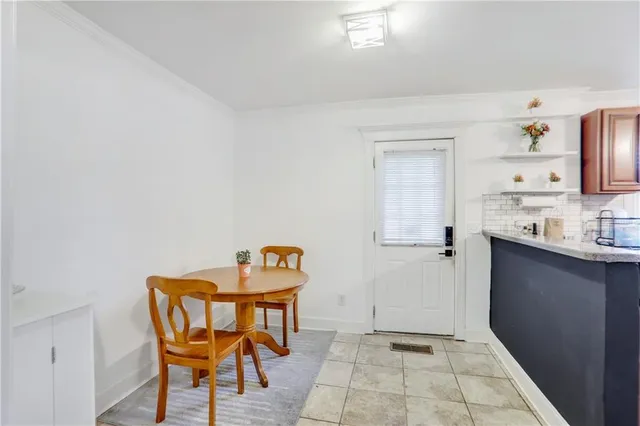 a view of a room with lounge chair and a window