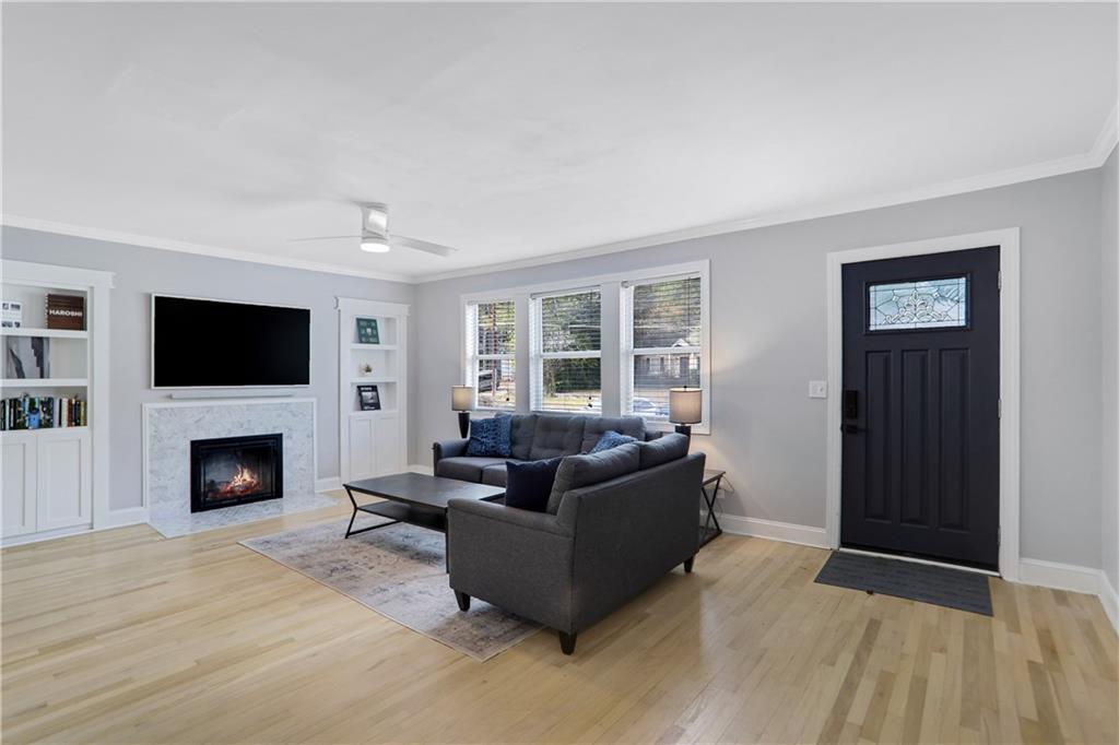 1275 Eastland Road Southeast Atlanta, GA 30316 - Photo 7 of 31 a living room with furniture and a fireplace