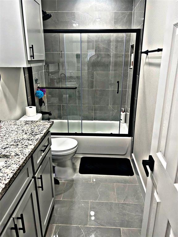 2631 Fish Tank Road Corsicana, TX 75110 - Photo 29 of 40 a bathroom with a granite countertop sink toilet and shower